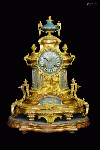 A Gilt Bronze Mental Clock with Two Boys and Porcelain