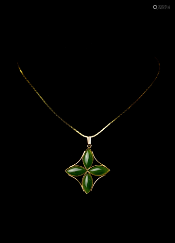 A Spinach Jade Four-Petal Flower Design Pendant