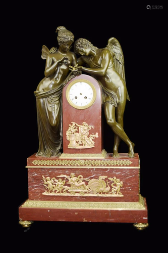 A Brick Red Marble Mental Clock with Bronze Sculpture