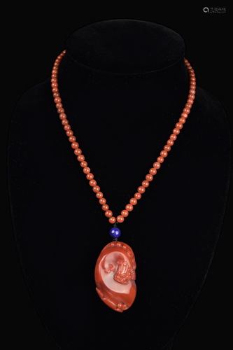 A Chinese Nanhong Agate Dragon Pendant with Nanhong