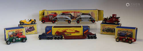 A collection of Matchbox vehicles, including an M-8 car tran...