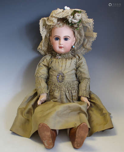 A Jumeau bisque head doll, impressed 'Depose Jumeau 10' and ...