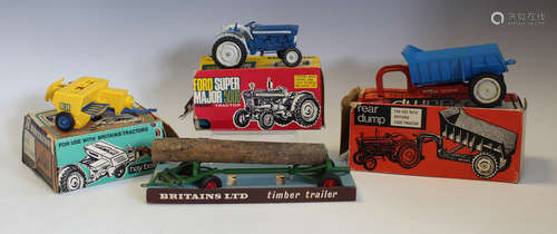 A small collection of Britains vehicles, farm implements and...