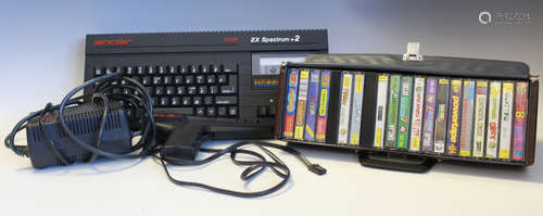 A Sinclair ZX Spectrum +2 home gaming computer and a collect...