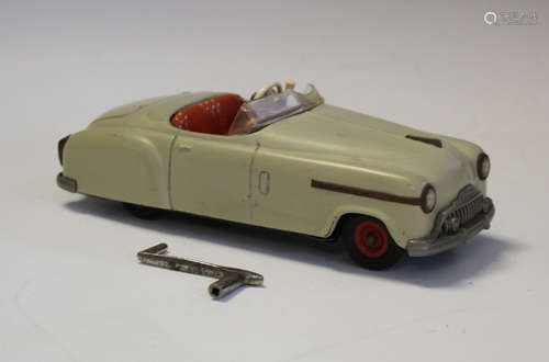 A Schuco Combinato 4003 tinplate clockwork car, finished in ...