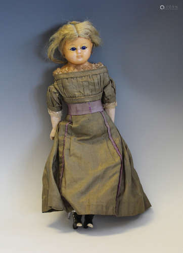 A wax over composition head and shoulders suffragette doll w...