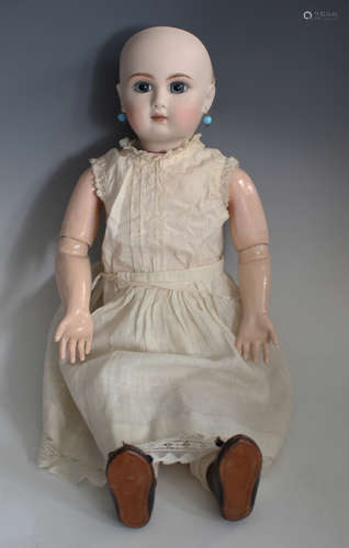 A modern Jumeau style bisque head doll with blonde wig, pier...