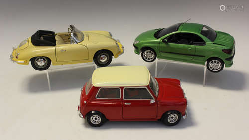 A collection of 1:18 scale and other models cars, including ...