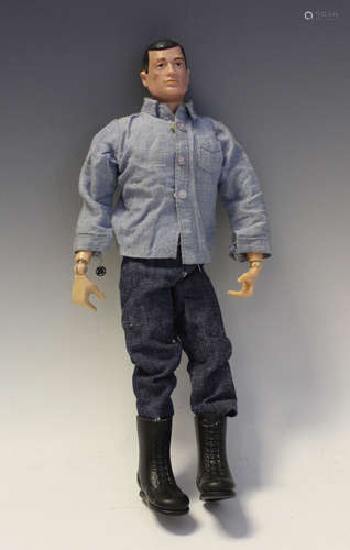 An Action Man sailor figure wearing blue denim shirt and tro...