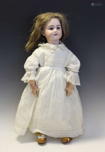 A bisque head doll, impressed 'DEP10', with brown wig, pierc...