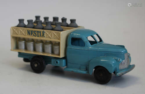 A French Dinky Toys No. 25-0 milk truck, finished with blue ...