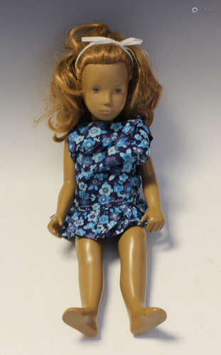 A Sasha vinyl doll with auburn hair and painted features, he...