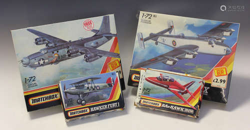 A collection of fourteen plastic model kits, including a Mat...