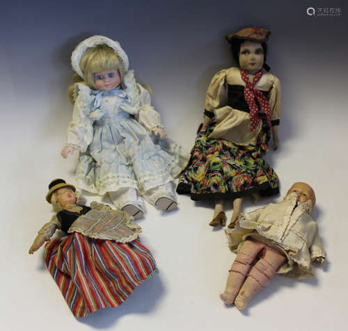 A small collection of dolls, comprising a plastic head and s...