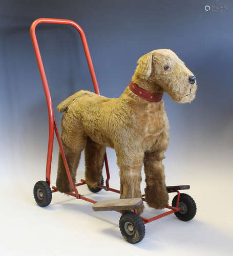 A Tri-ang mohair push-along dog on a steel frame and tyres, ...