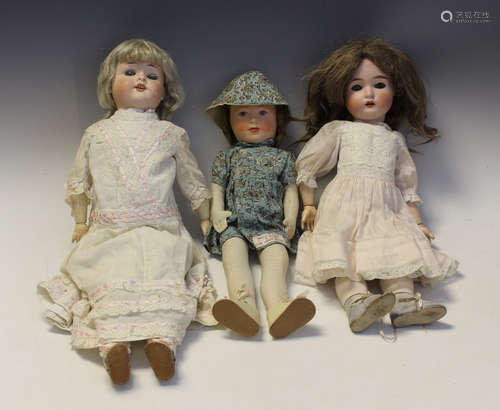 A bisque head doll, impressed '50', with later brown wig, sl...