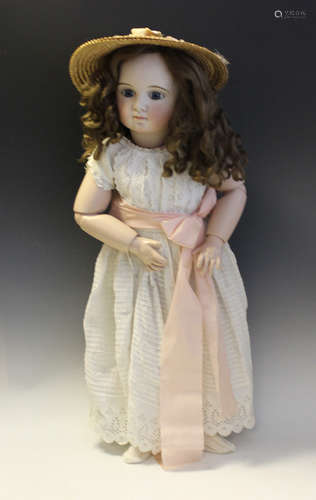 A modern French Steiner style bisque head doll by Gina Saund...