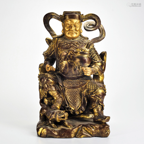 A Carved Wooden Gilt Seated Guardian Qing Dynasty