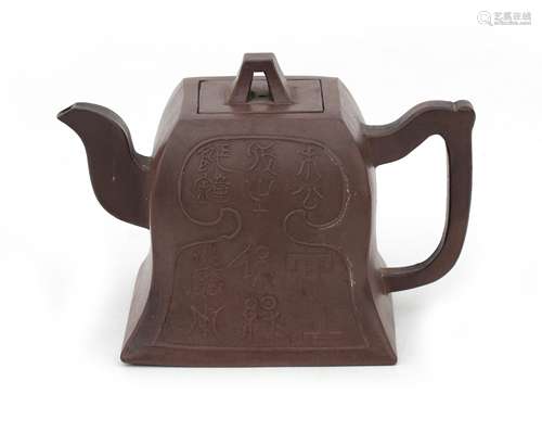 A bel-shaped brown earthenware Yixing teapot decorated with ...