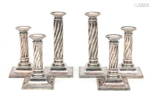 Set of six silver table candle sticks with twisted stem on s...