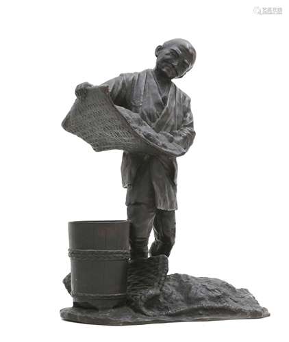 A Japanese bronze sculpture of a man with bucket and sieve, ...