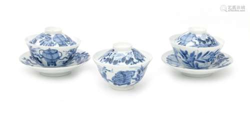 Three Chinese blue and white porcelain cups with lids and tw...