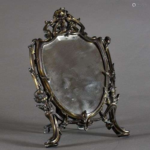 Miroir de toilette en régule anciennement doré, la glace bis...