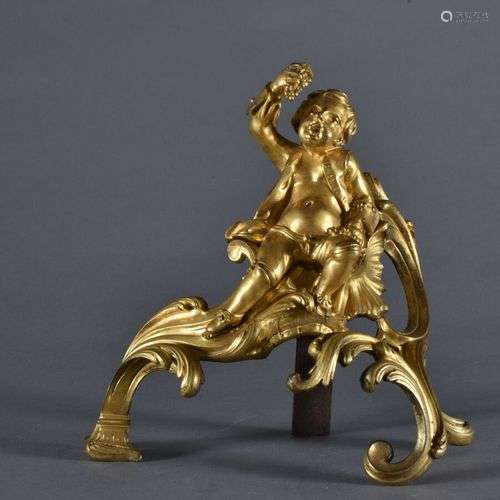 Tête de chenet de cheminée en bronze doré figurant un enfant...