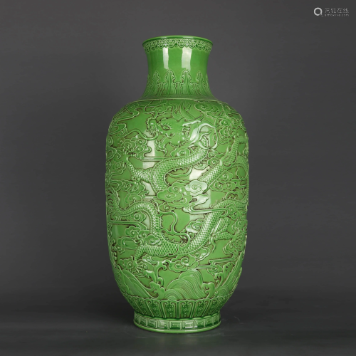A GREEN GLAZE RELIEF DECORATED VASE