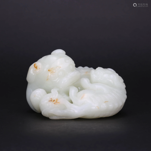 A CARVED WHITE JADE PAPER WEIGHT