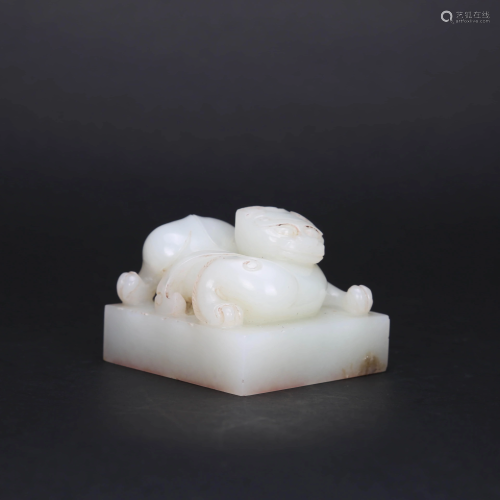 A CARVED WHITE JADE CHILONG SEAL WITH INSCRIBED