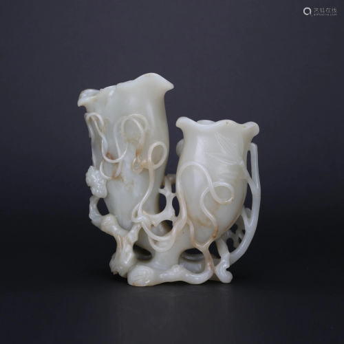 A CARVED WHITE AND RUSSET JADE FLOWER VASE