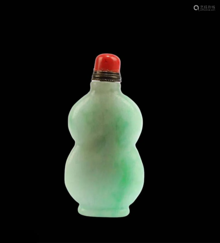A Carved Jade Snuff Bottle