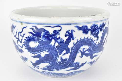 A 19th century Chinese blue and white planter with curved si...