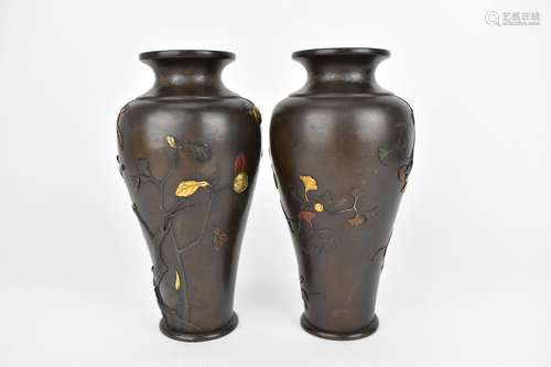 A pair of Japanese Meiji period patinated bronze vases, of t...