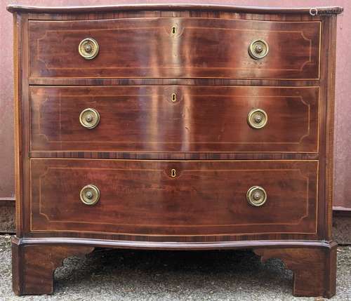 A George III string inlaid mahogany serpentine front chest w...