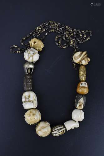 A 19th century Japanese ojime bead necklace, with carved ivo...