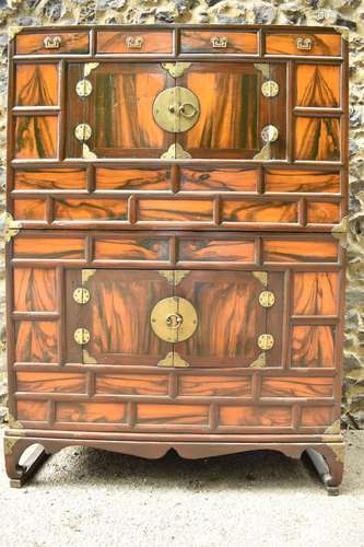 A Korean 19th century two part Tansu cabinet, with brass bra...