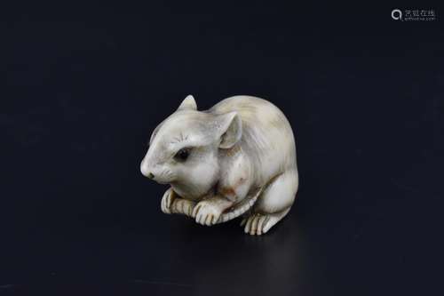 A Japanese Meiji period carved ivory netsuke modelled as a r...