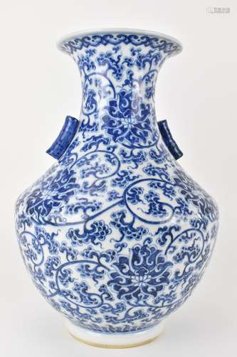 A Chinese late Qing dynasty blue and white hu vase with twin...