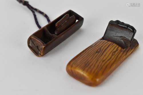 Two Japanese 19th century stained ivory netsuke, one a woodw...