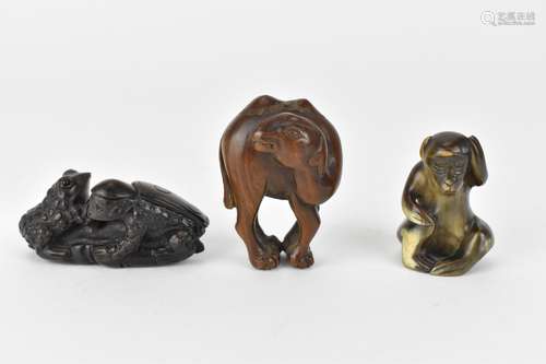 Three 20th century netsuke, one of a camel and another of tw...