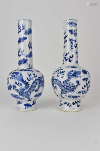 A near pair of Chinese Qing dynasty blue and white bottle va...