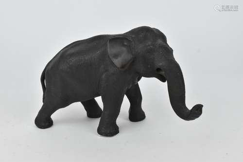 A Japanese Meiji period patinated bronze model of an elephan...