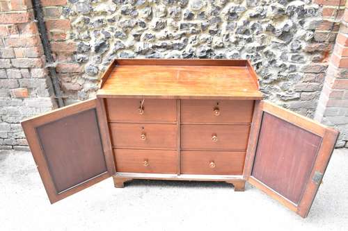 An early 19th century mahogany chest with a galleried top ov...