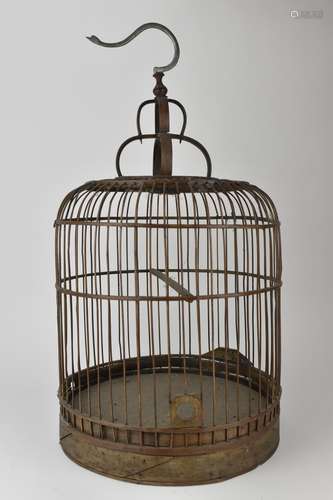 A 20th century Chinese wooden and cane bird cage, with a met...