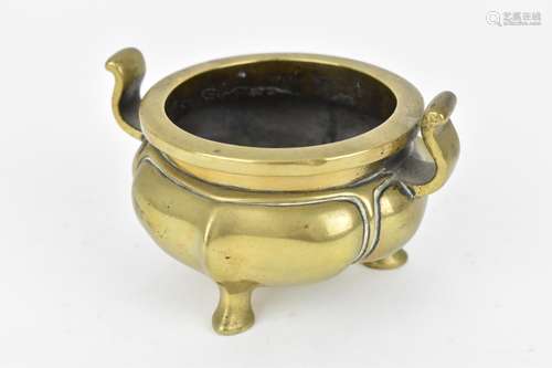 A Chinese bronze tripod censer, with lotus shaped base and c...