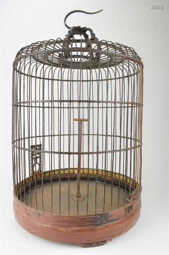 A large 20th century Chinese brown painted wooden bird cage ...