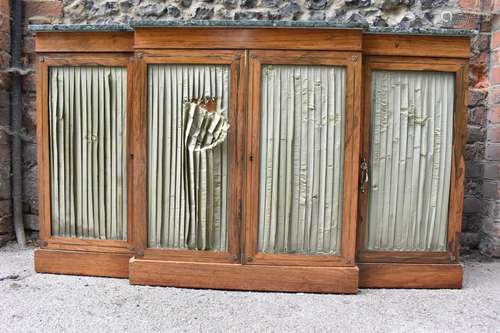 A Regency brass string inlaid rosewood breakfront cabinet, w...