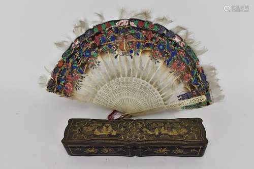 A Chinese Qing Dynasty ivory fan with painted feathers, fret...